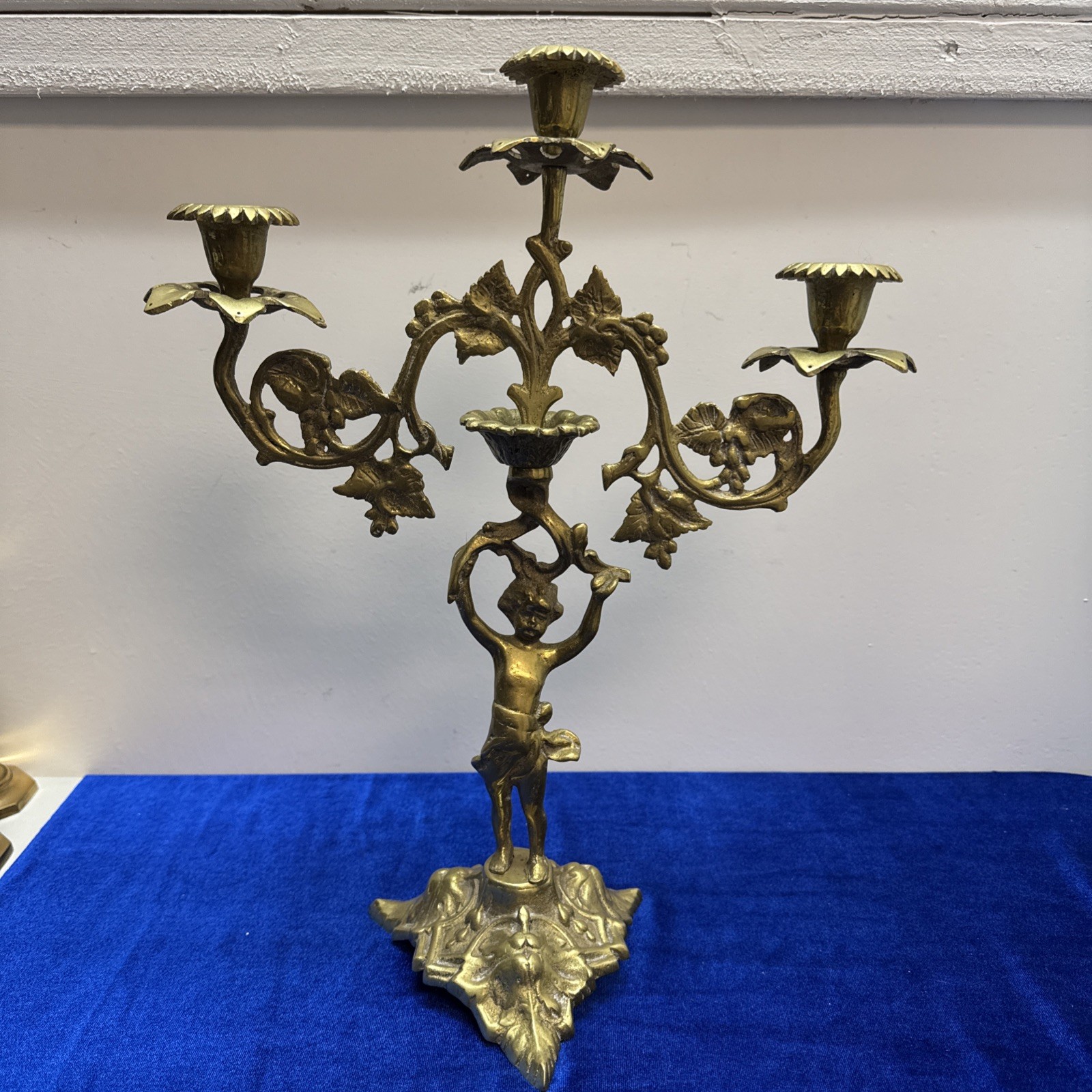 Antique brass cherub candelabra With leafy pedestal base orn