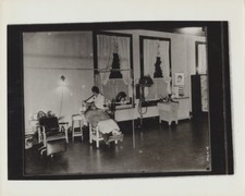 PHOTO OF OLD SCHOOL SALON W/ UNUSUAL EQUIPMENT FROM NEGATIVE ON PHOTO PAPER 