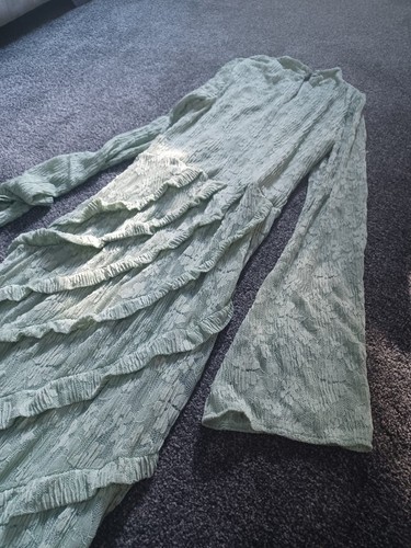 Michelle kegan figure hugging sage green dress