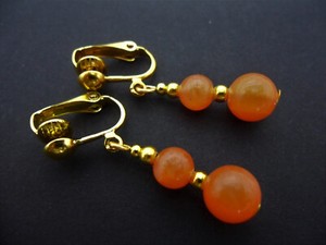 Authentic A PAIR OF ORANGE JADE GOLD PLATED DANGLY CLIP ON EARRINGS. .
