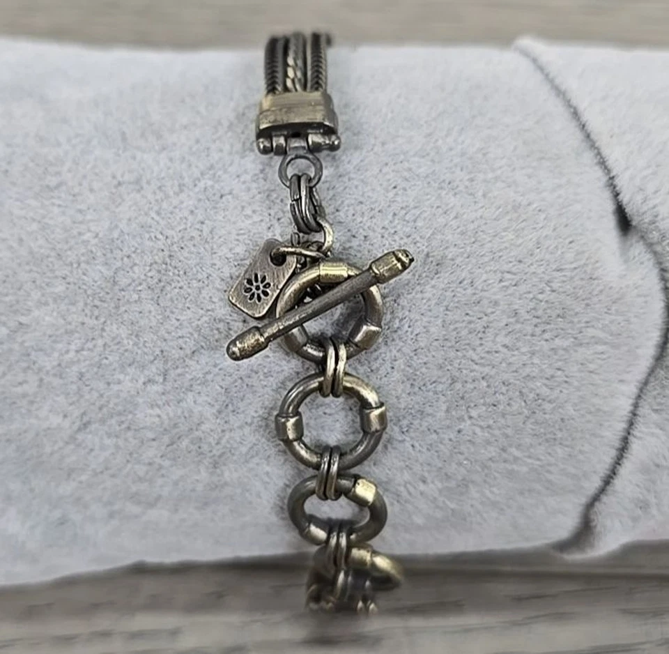 Pulsera de cierre de palanca de presión de jengibre tono dorado con 7 broches de presión Foto 4 de 4