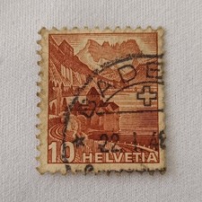 Helvetia Timbre Suisse 10 brun paysage architecture oblitéré, cachet à la main