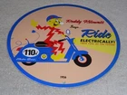 VINTAGE 56 REDDY KILOWATT ELECTRIC SCOOTER 11 3/4" PORCELAIN METAL GASOLINE SIGN