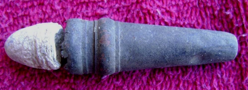 (2) DUG BURNSIDE CASINGS w/BULLET STACKED TOGETHER BY SOLDIER (PORT HUDSON)
