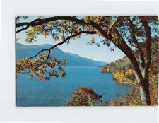 Postcard Morning mists rise from the quiet waters of Lake George New York USA