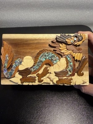 Carver Dan's hand-crafted wooden puzzle box with a mother-of-pearl dragon inlay