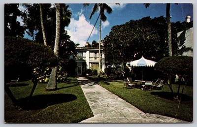 Vintage Clewiston Inn Patio Garden Florida Postcard by International Graphics
