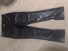 NWT H M faux leather split hem flare trousers. Size L