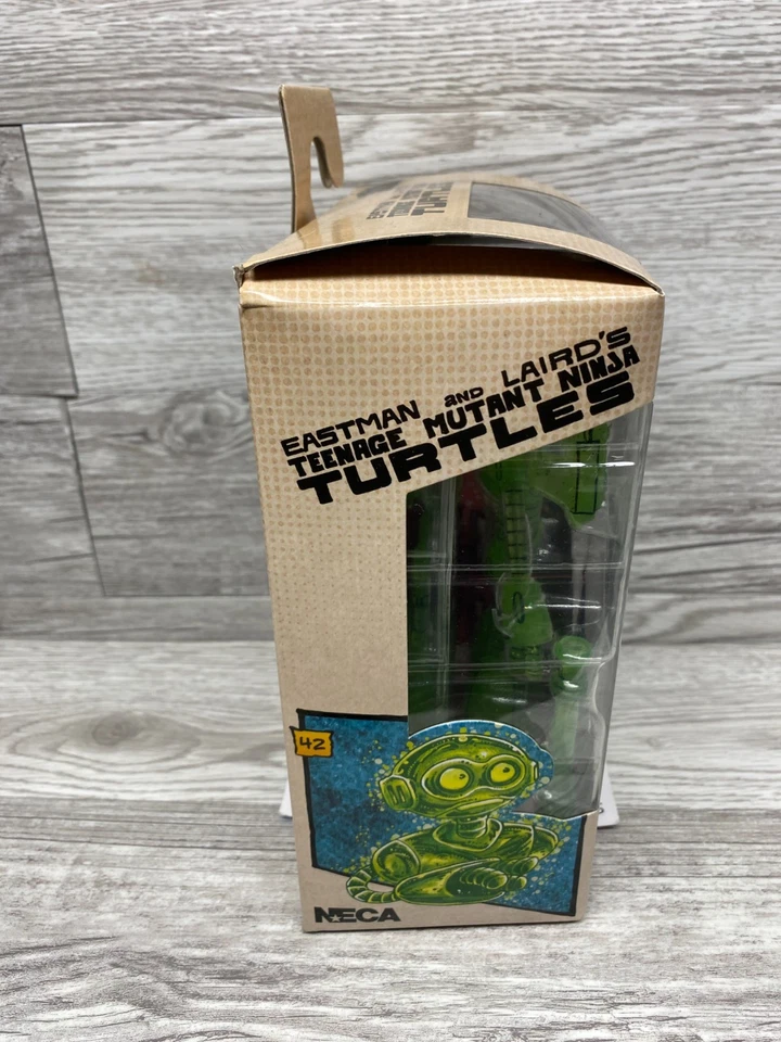 Auténtico NECA Eastman and Laird's TMNT Fugitoid Transmat verde brilla en la oscuridad Foto 2 de 3