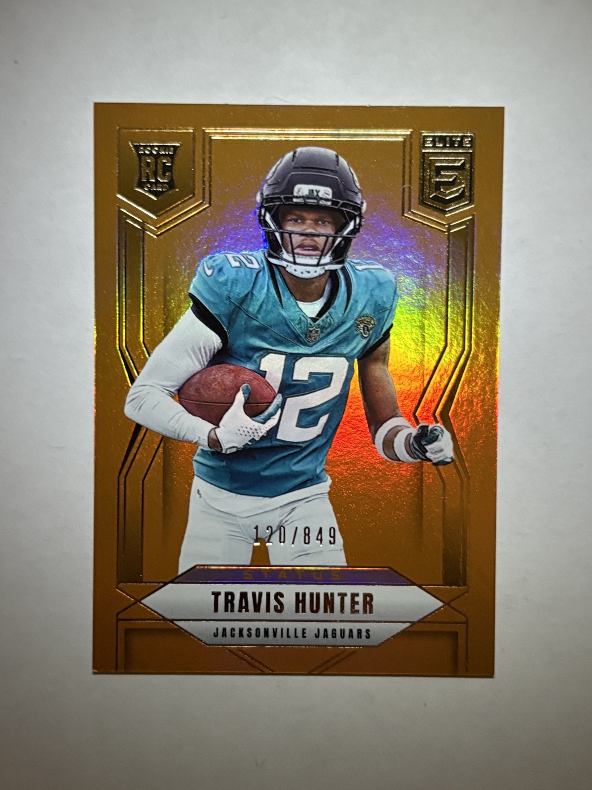 2025 Panini Donruss Elite Travis Hunter #114 Status Metallic Orange /849 (RC)