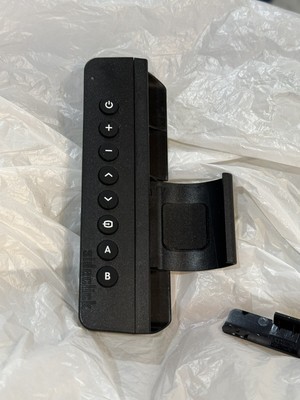 Side click Universal Remote; Preowned