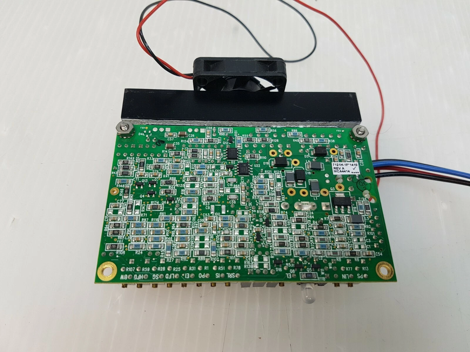 Solder side of the Lumenis 7121H-1F*1410 board with fan on top of the heatsink