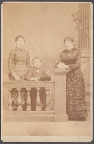 Mother daughter & son studio balustrade cabinet by J H Emerson Keokuk IA