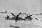WW2 - The Gi's take shelter behind the tetra-earths in Omaha Beach Jun 6 44