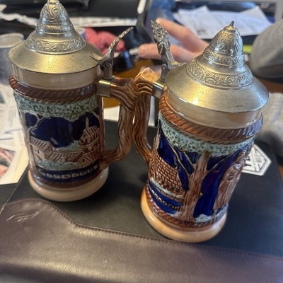 Pair Of vintage German ceramic beer stein with a pewter lid