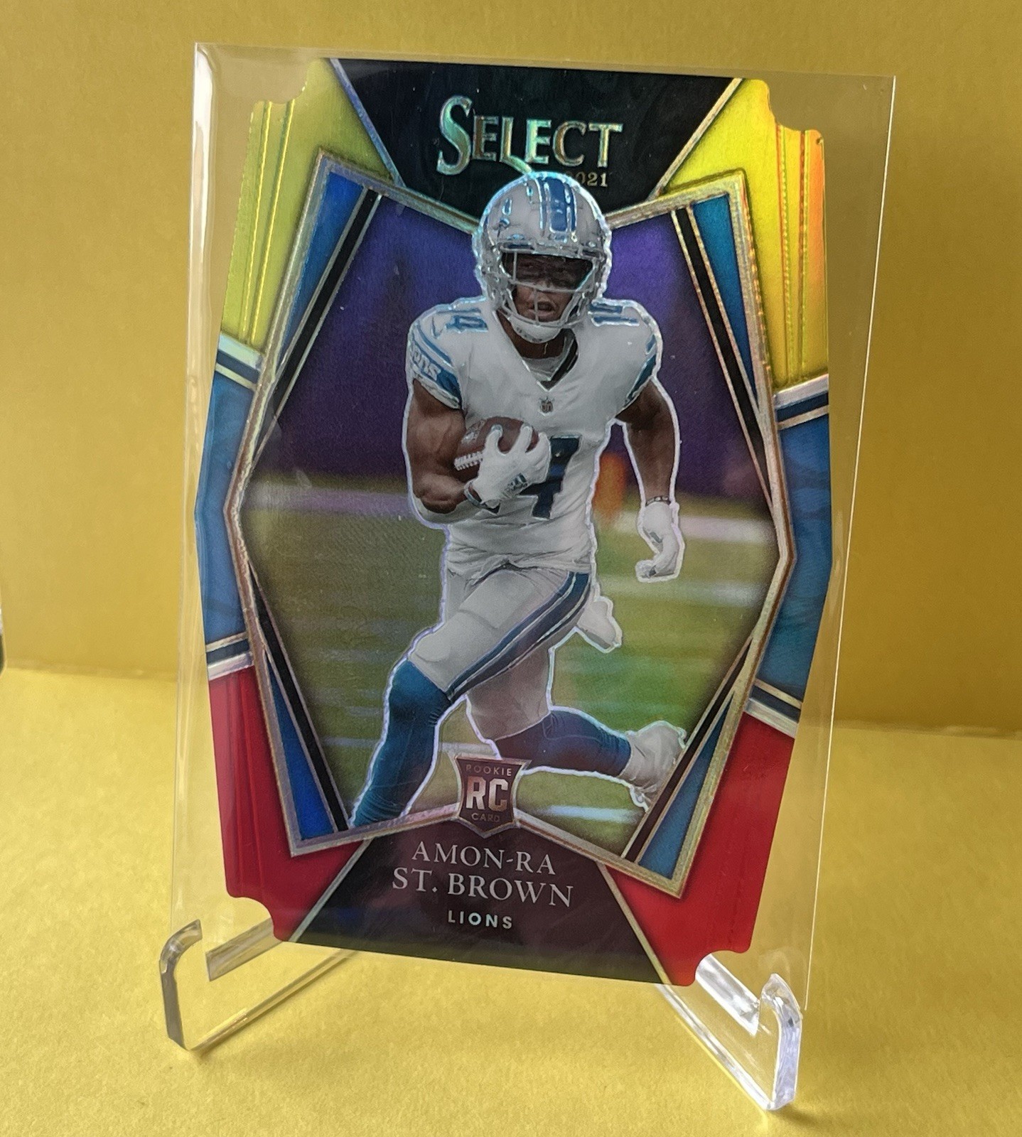 2021 Select Prem. Lvl. Amon-Ra St. Brown #173 Red & Yellow Prizm Die-Cut (RC)