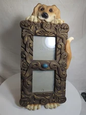 Smiling Dog Holding Photo Frame United Design Stamped D.W. 1999 Glass Eyes Nails