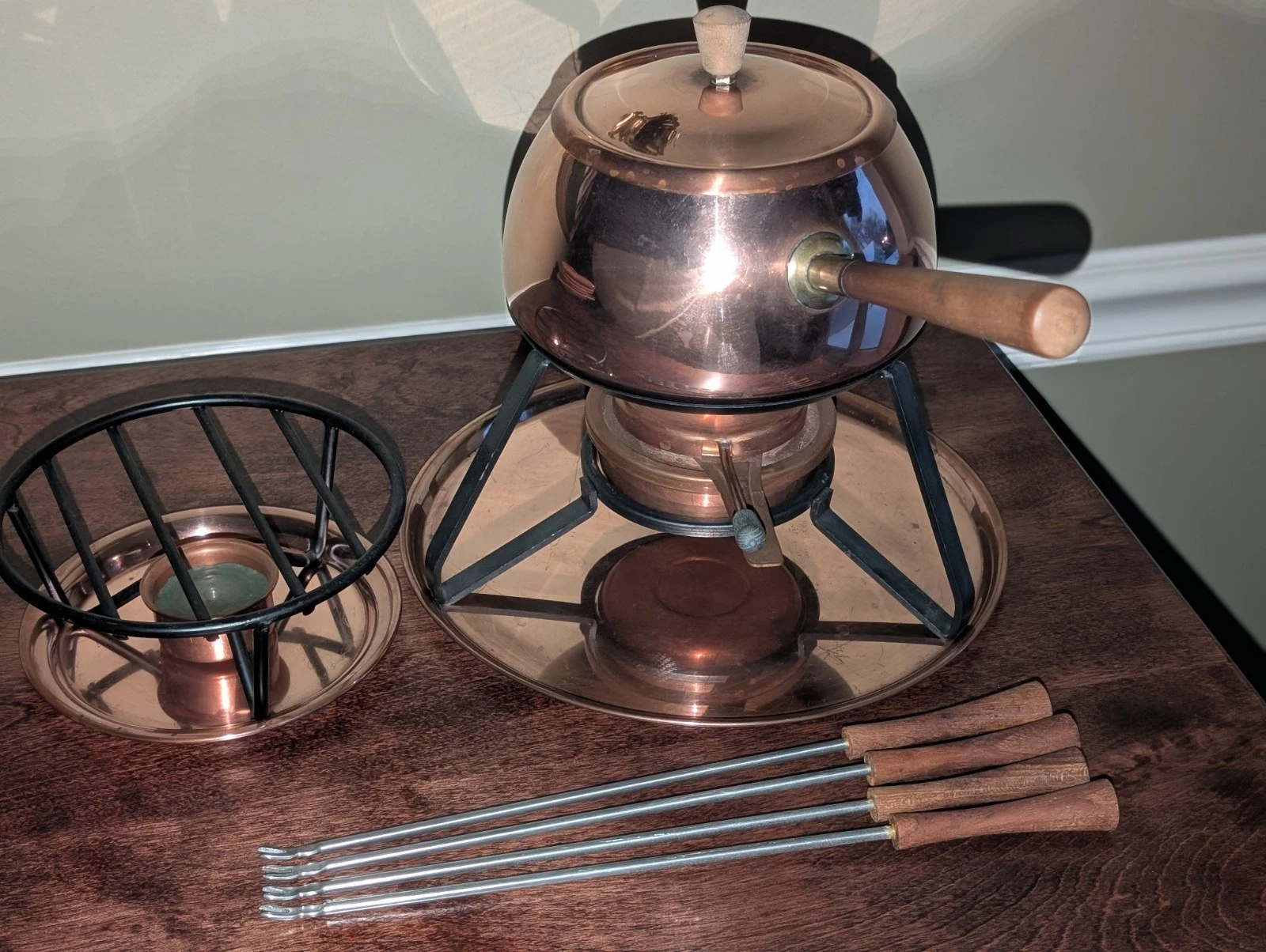 Vintage Perk SwissMade Copper On Metal 13 Piece Fondue Set w/Wrought Iron Stands
Opens in a new wind