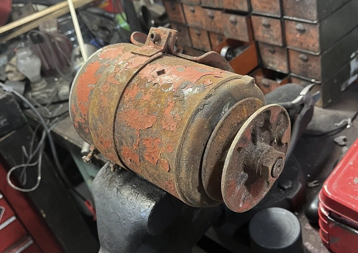 A used generator for a classic Ford engine.