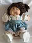 VTG 1985 Cabbage Patch Doll Brown Hair/Brown Eyes One Tooth W Blue & Pink Romper