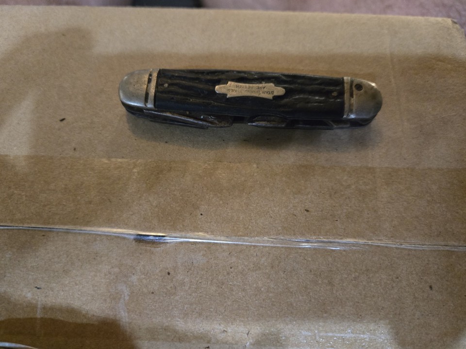 A working pocket knife that doubles as a piece of American advertising history — 'Star Brand Shoes Are Better' right on the blade.
