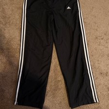 Black adidas track pants with