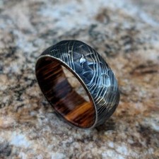 Damascus Steel Wedding Band With Ironwood Sleeve And Hammered Finish