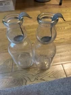 Vintage glass milk bottles w creamer tops/metal spoons.  One Polk one Cream Top