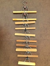 10 Wooden Hangers for Pants or Skirts, 9- 13" long. Ridged inner surfaces.
