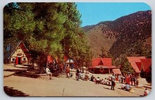 Santa's Workshop North Pole CO 1961 Postcard Visitors Elves Santa Scene