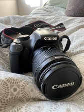 Canon EOS 1100D single-lens reflex camera (DSLR) with an 18-55mm lens