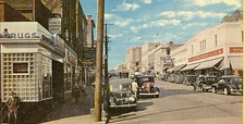 Postcard  Early View of Main Street & Corner Drug Store, Willamantic, CT.     S9