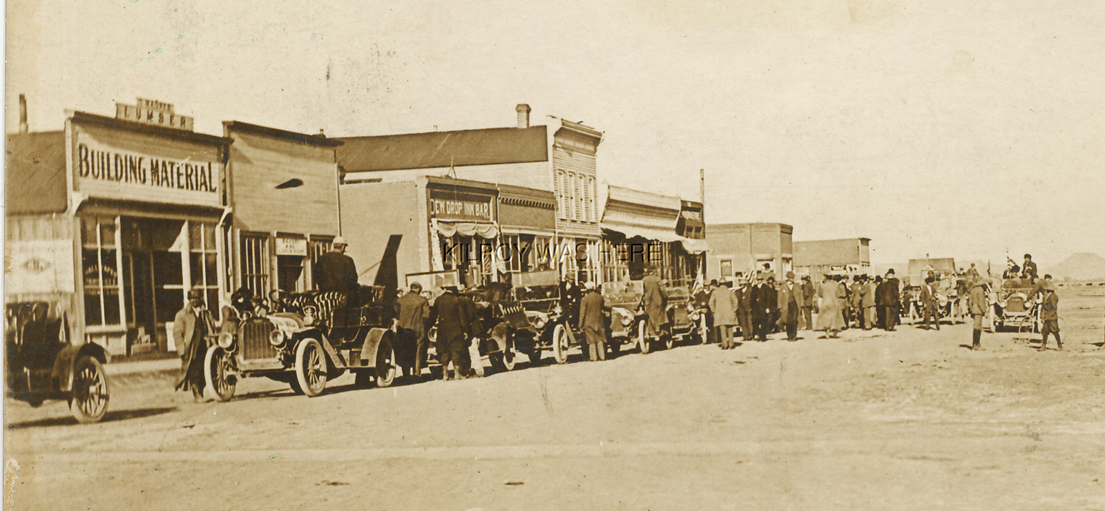 1912 RPPC MAIN ST LA JARA COLORADO DEW DROP BAR STORES BUSY CANC
