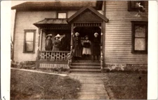 Vintage RPPC Postcard Family Standing on Their Front Porch                 D-414