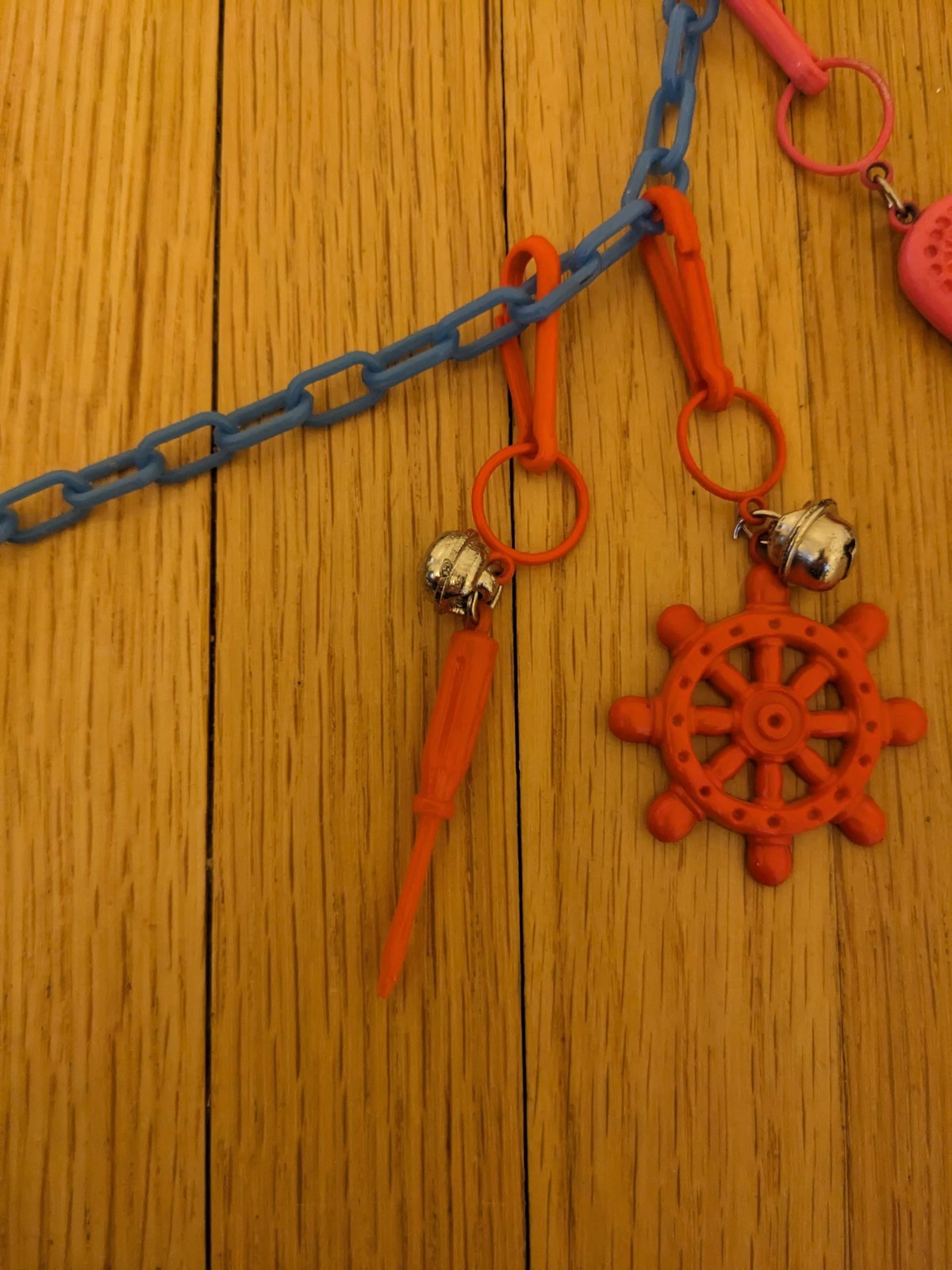 VINTAGE 1980’S BELL CLIP CHARM NECKLACES 80’S, 10 charms blue chain white clasp 