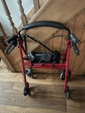 Four Wheeled Walker With Seat and Brakes