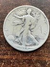 1934 s walking liberty half dollar au a fine coin . pluse a surprise