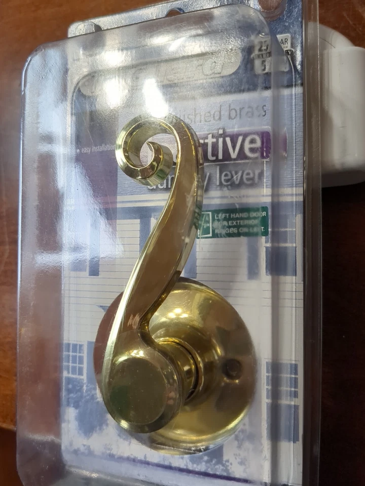 Manija de puerta de palanca de maniquí inactiva de latón pulido TruGuard Foto 2 de 4