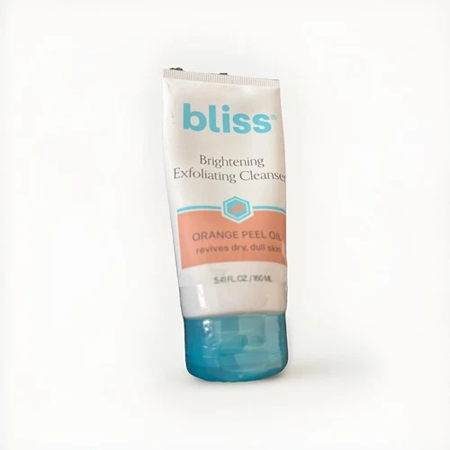 White tube of Bliss Brightening Exfoliating Cleanser with orange peel oil, blue cap, and textured wet look.