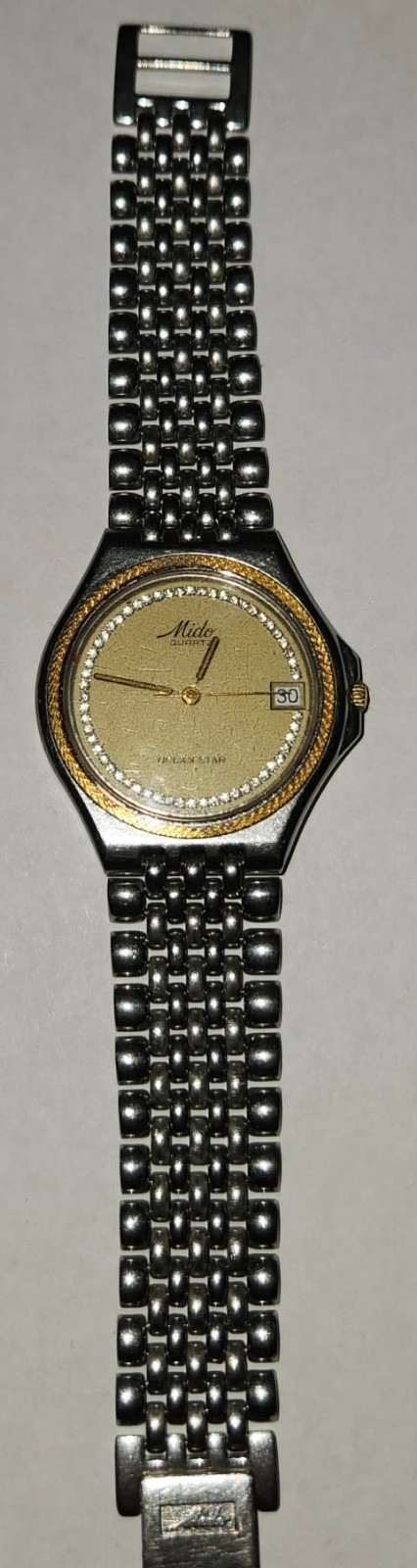 mido ocean star with 57 diamond and golden rope around Dian