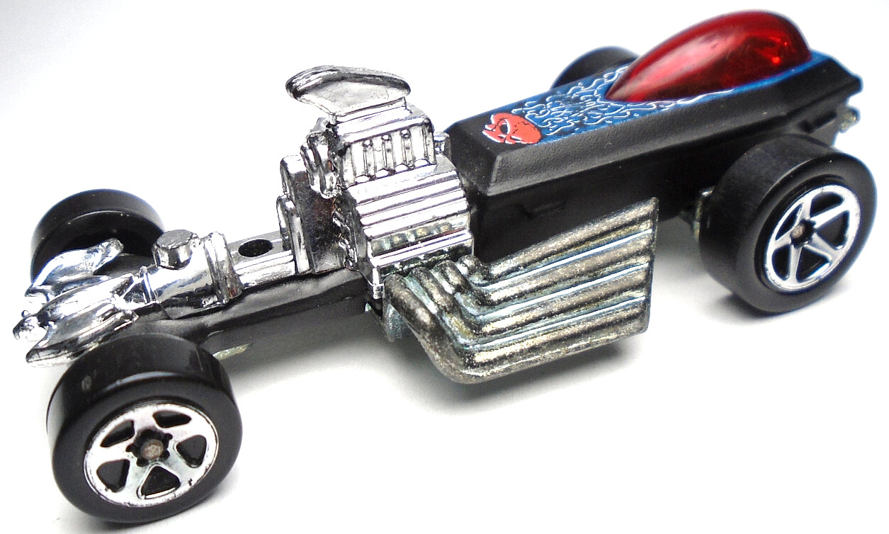 2005 HOT WHEELS RIGOR MOTOR BLACK 1:64 DIECAST 3" RACE CAR WITH RED & BLUE