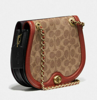 One Coach parker saddle bag in Leather & signature canvas Two sided