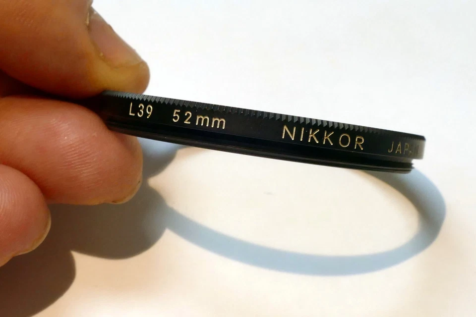 Nikon Nikkor 52mm L39 Filter UV Haze  - genuine , with coating separation - Image 3 of 4