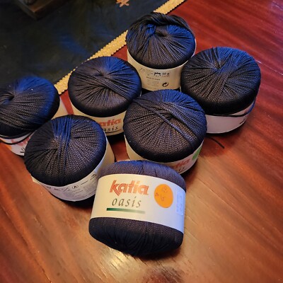 8 skeins of black Katia Oasis yarn. Spain