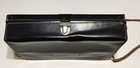 Black vintage leather shoulder bag with silver clasp and strap, made in USA by Diamond, on white background.