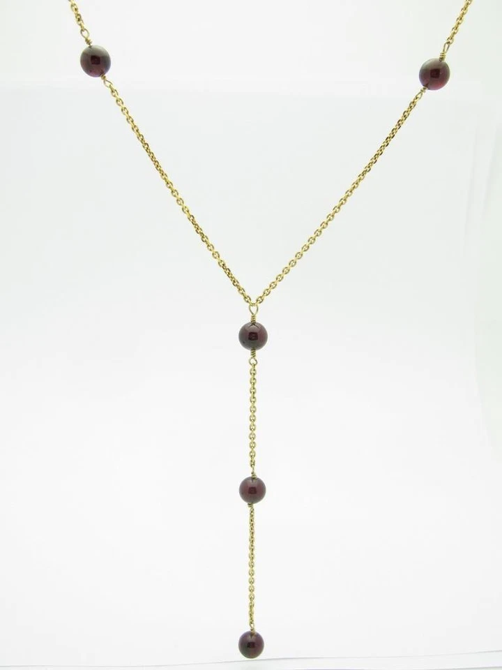 Collar con halo de cuentas de araña diseño Lariat de granate rojo y oro amarillo de 14k 