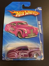 2009 Hot Wheels #157  Tail Dragger - metallic darker blue - Modified Rides 1/10