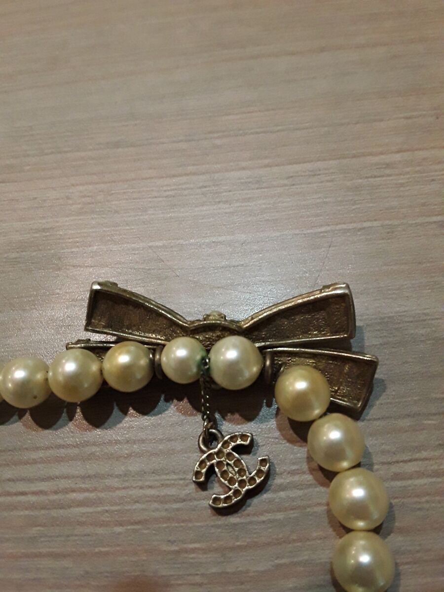 Chanel Necklace, pre owned. Missing Pearl's and rhinestones. 16"  long.