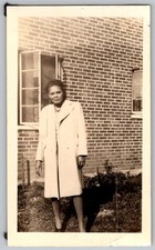 Vtg B&W Snapshot Elegant Woman In Long White Coat By Brick House Window 1948