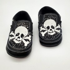Vans Black slip on baby shoe w/ white skull graphics Size 1